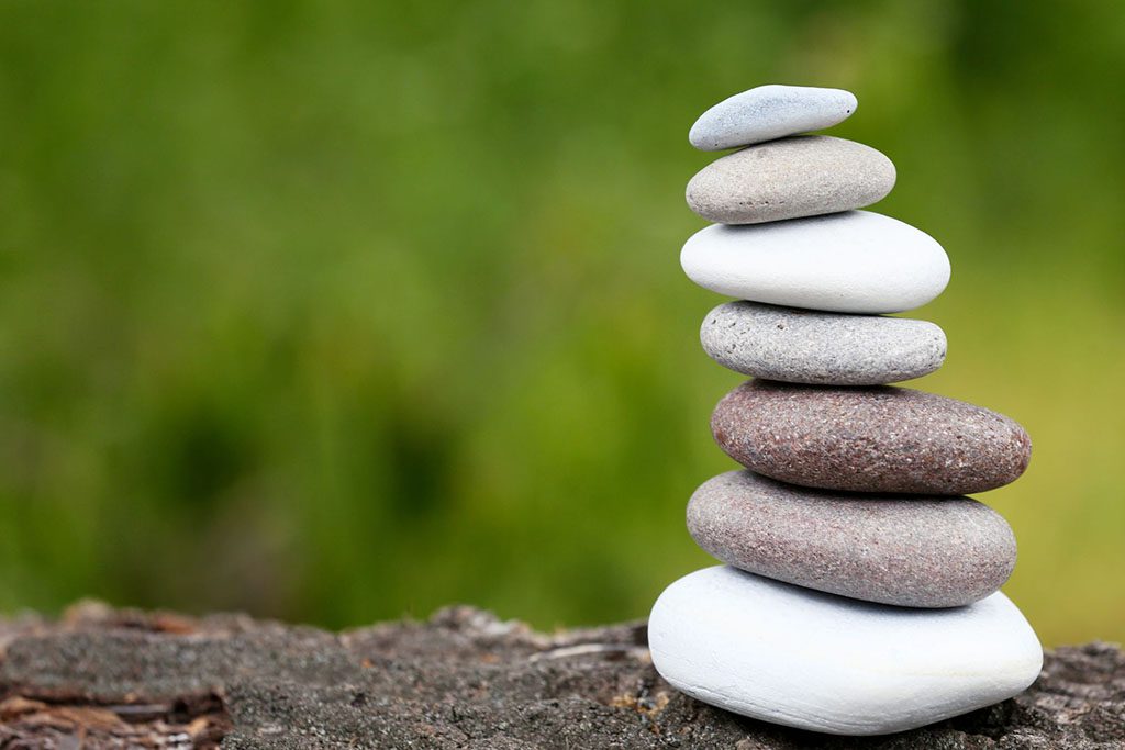 Stack of rocks in nature representing the natural dentistry also known as holistic dentistry or biologic dentistry that Dr. Digiorno offers near Folsom, CA, 95630 / 95671 / 95742 / 95763