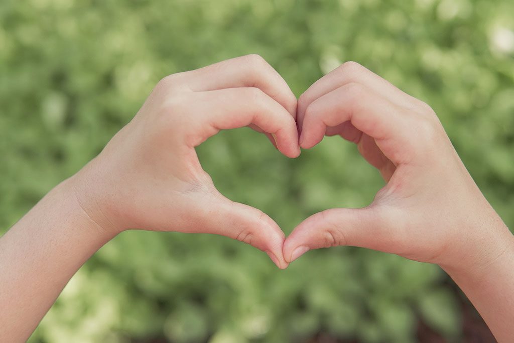 Two hands forming a heart representing the love of finding a holistic dentist near Citrus Heights who uses non toxic, non invasive dental options for full health