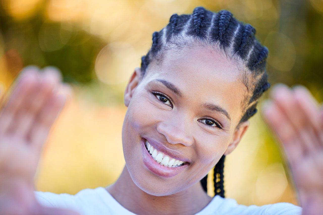 young woman showing off her fabulous smile consider a smile makeover with cosmetic dentistry